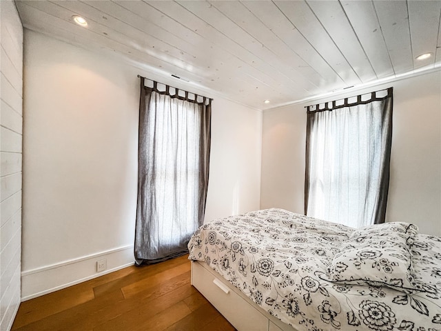 bedroom with hardwood / wood-style floors