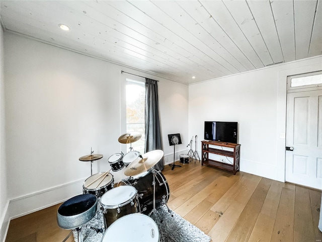 interior space with hardwood / wood-style flooring and wooden ceiling