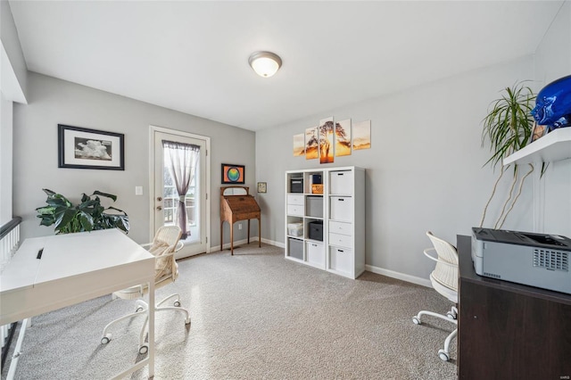 carpeted office featuring baseboards