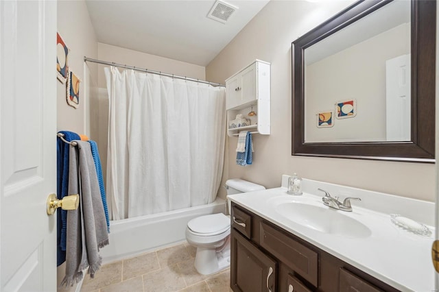 bathroom featuring visible vents, shower / bath combo with shower curtain, toilet, and vanity