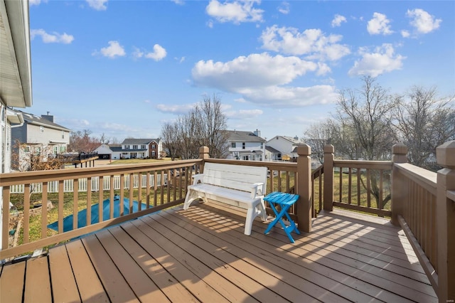 wooden terrace featuring a residential view