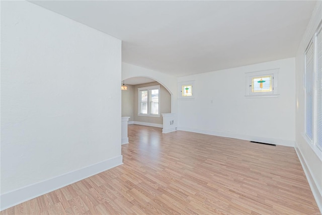 empty room with light hardwood / wood-style floors