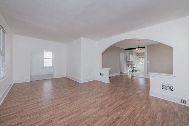 unfurnished living room with light hardwood / wood-style flooring