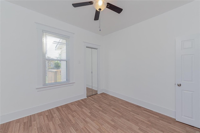 spare room featuring light hardwood / wood-style floors and ceiling fan