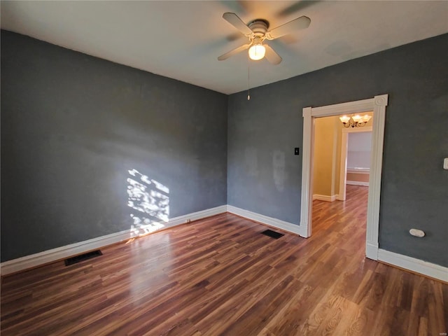 unfurnished room with ceiling fan and dark hardwood / wood-style floors