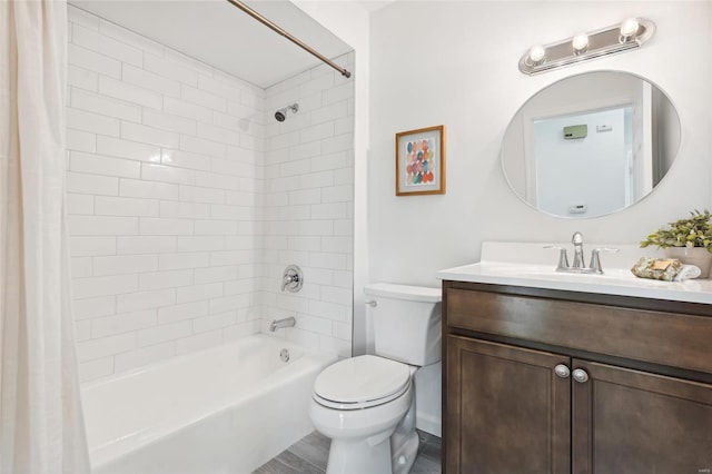 full bathroom featuring vanity, shower / tub combo, and toilet