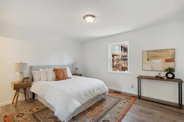 bedroom with hardwood / wood-style floors