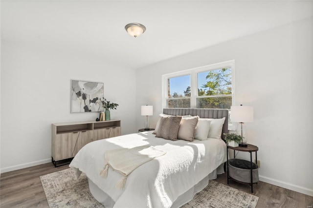 bedroom with hardwood / wood-style floors