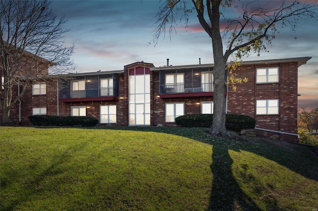 view of outdoor building at dusk