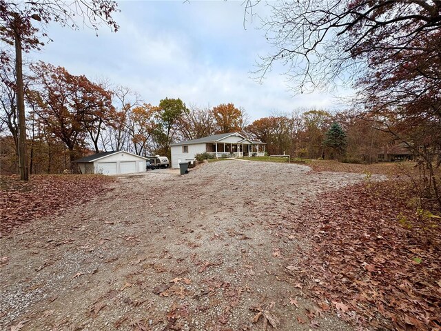 view of front of house featuring an outbuilding