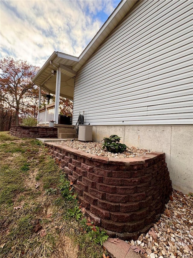 view of property exterior with covered porch