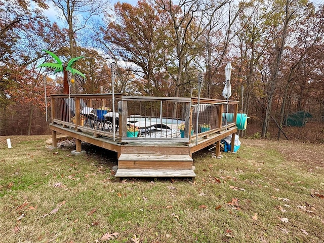 wooden deck with a lawn