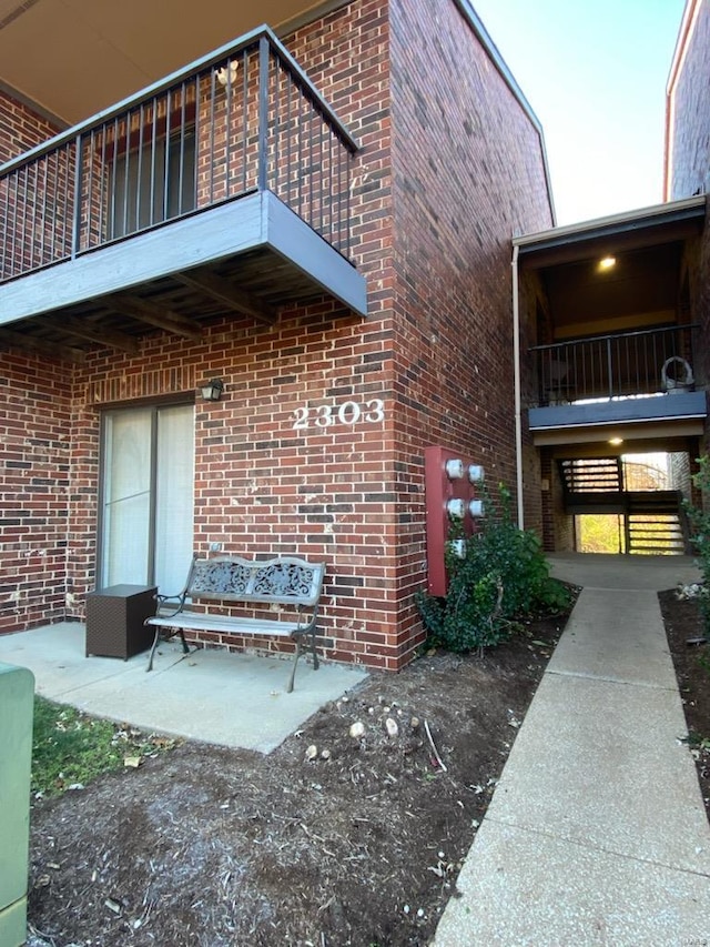 doorway to property featuring a balcony