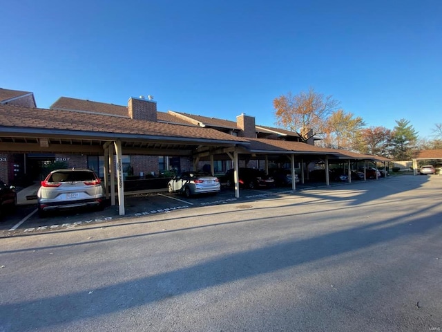 exterior space with a carport