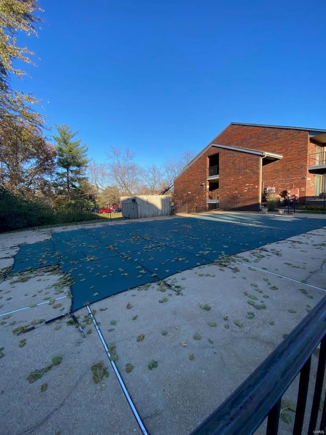 view of swimming pool featuring a patio area