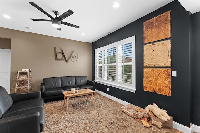 living room featuring ceiling fan