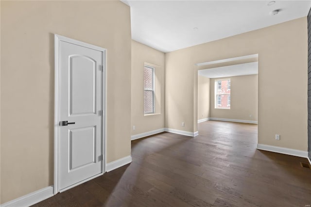 spare room featuring dark hardwood / wood-style floors