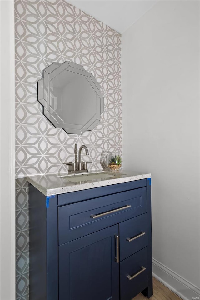 bathroom featuring hardwood / wood-style floors and vanity