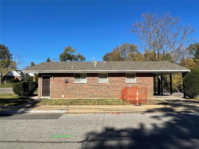 view of side of property featuring a carport