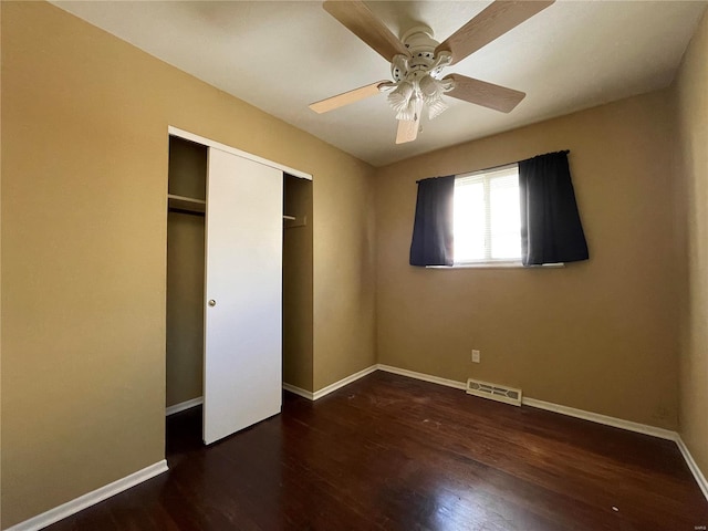 unfurnished bedroom with a closet, ceiling fan, and dark hardwood / wood-style floors