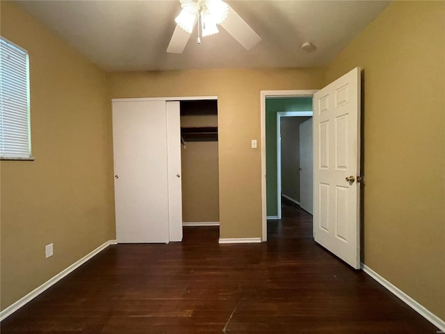 unfurnished bedroom with a closet, ceiling fan, and dark hardwood / wood-style floors