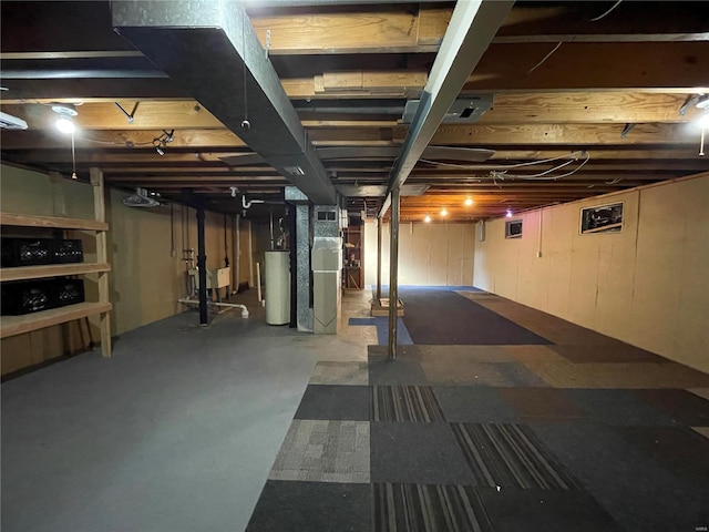 basement featuring heating unit and gas water heater