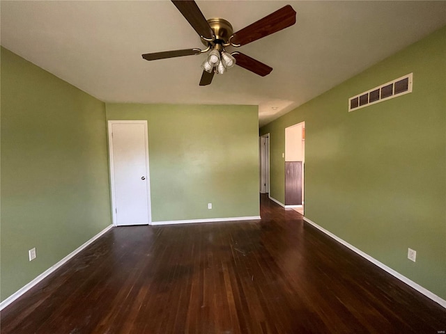 unfurnished room featuring dark hardwood / wood-style flooring and ceiling fan