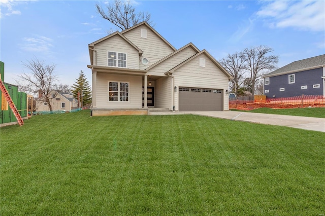 view of front of home featuring a garage and a front lawn