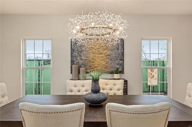 dining space featuring an inviting chandelier