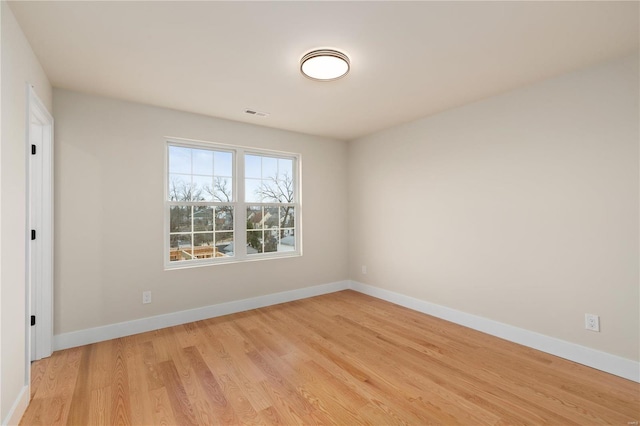 empty room with light hardwood / wood-style floors