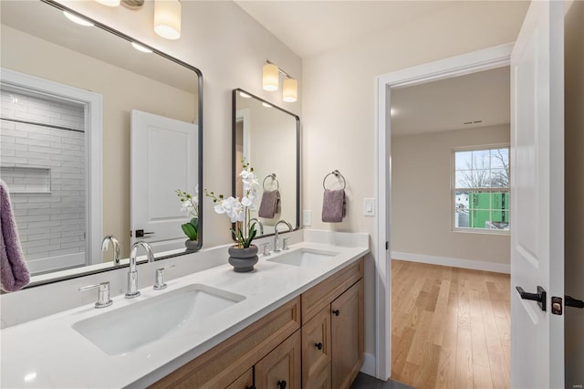 bathroom featuring vanity and hardwood / wood-style floors