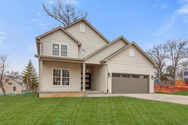 view of front of home with a garage and a front lawn