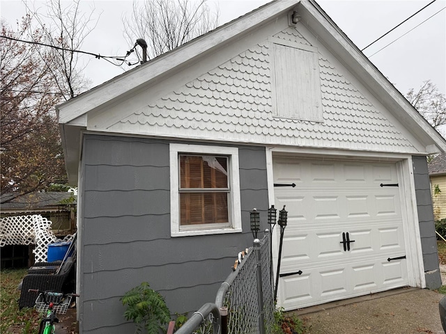 view of side of home featuring a garage