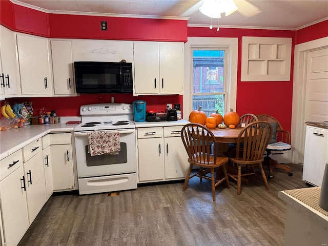 kitchen featuring white cabinetry, crown molding, and electric range