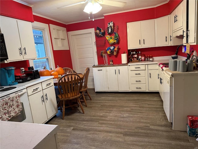 kitchen featuring white cabinetry, ornamental molding, ceiling fan, white range with electric cooktop, and dark wood-type flooring