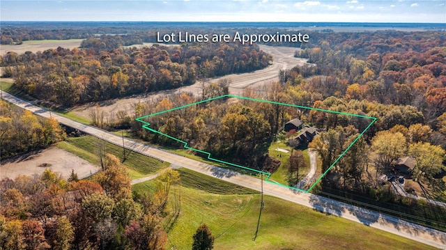 birds eye view of property with a rural view