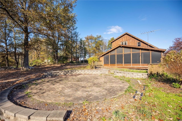 rear view of house with a sunroom