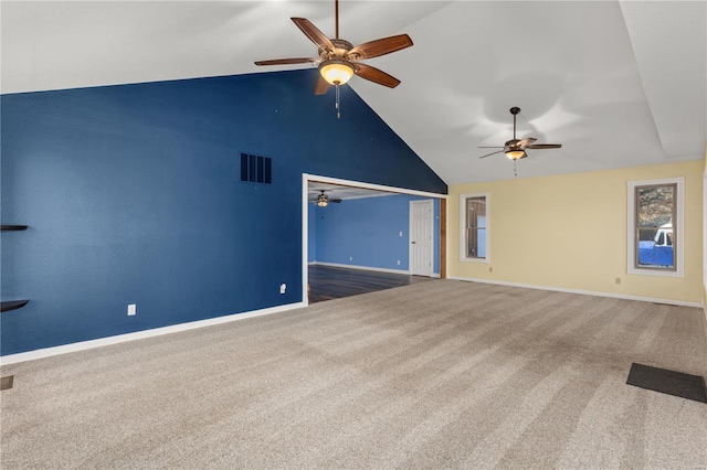 unfurnished living room featuring carpet floors and lofted ceiling