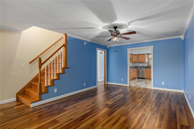 unfurnished living room featuring dark hardwood / wood-style flooring, ceiling fan, and ornamental molding