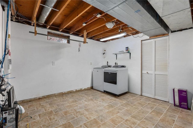 laundry area with washing machine and dryer