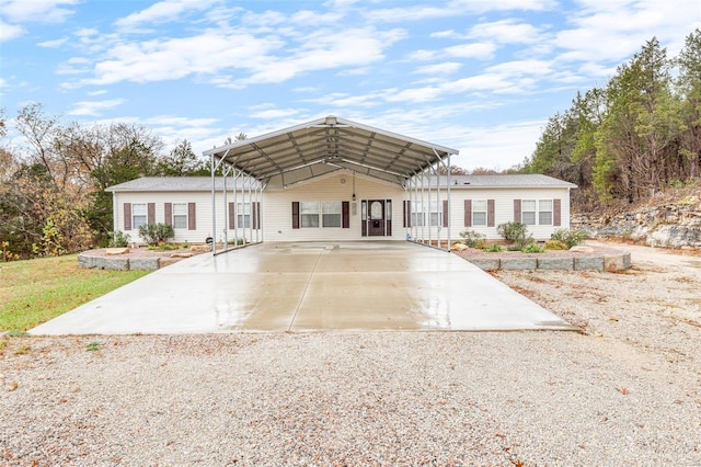 view of front of property featuring a carport