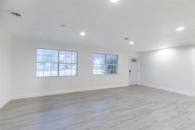 unfurnished room with light hardwood / wood-style flooring