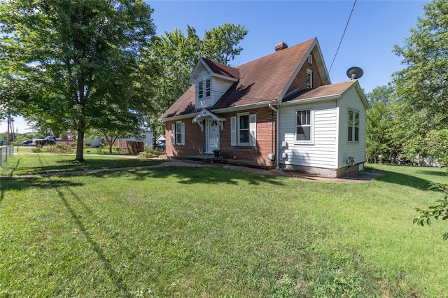 rear view of house with a yard