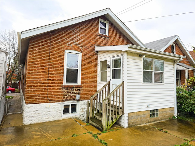 back of house with a patio