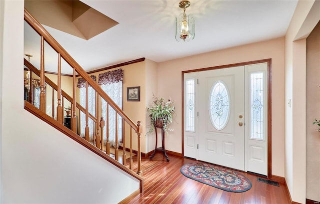 entryway with hardwood / wood-style floors