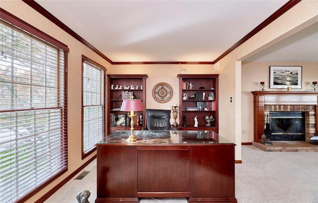 office area featuring light carpet, a fireplace, and ornamental molding