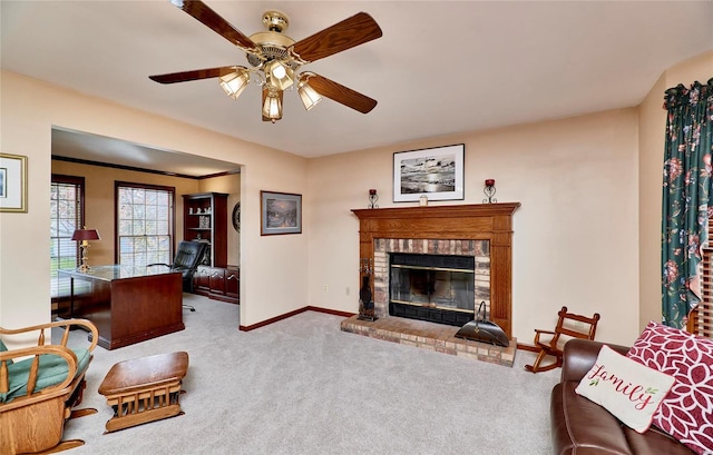 living room featuring light carpet, ceiling fan, and a brick fireplace