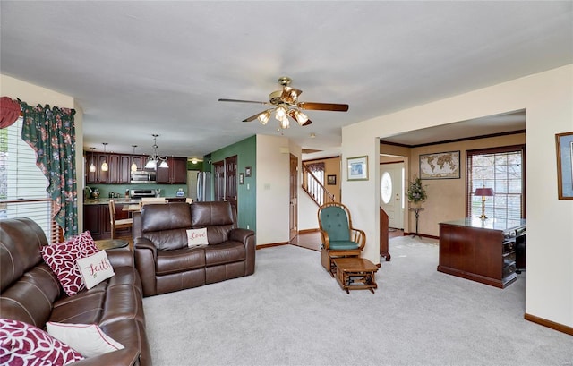 living room featuring light carpet and ceiling fan