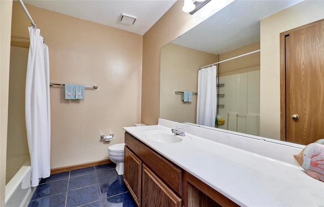 bathroom with tile patterned floors, vanity, and toilet