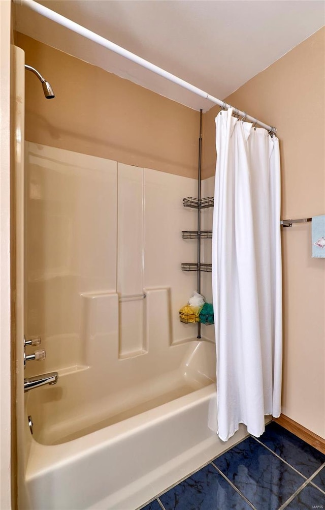 bathroom featuring tile patterned flooring and shower / bath combination with curtain